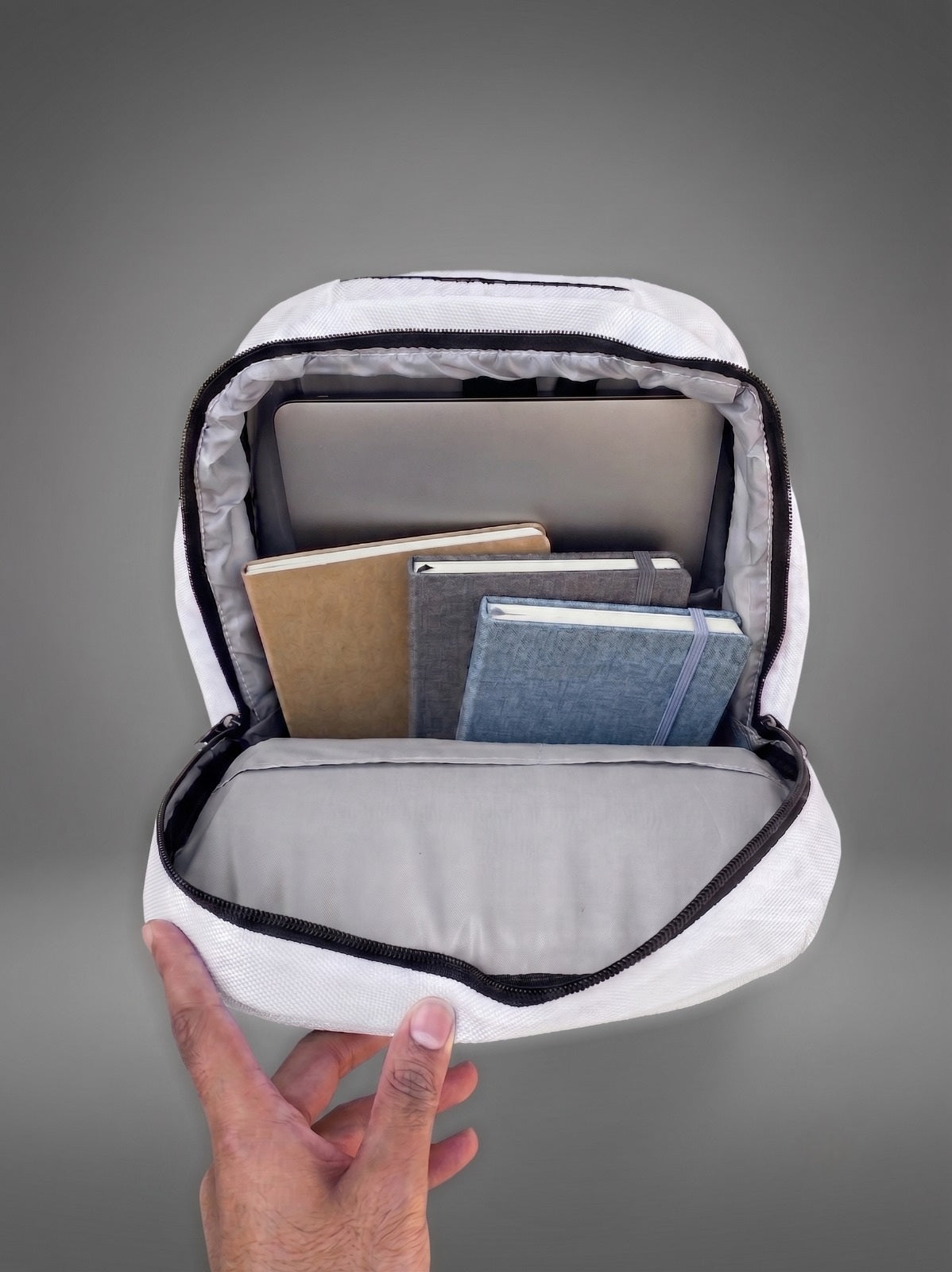 AZAR Uraan laptop bag open compartment showing laptop, notebooks, and charger fit