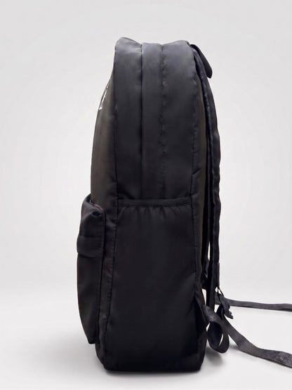 La Haasil black laptop bag side view, slim profile with water bottle pocket
